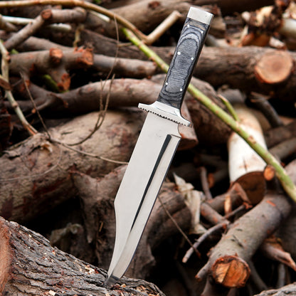 Close up view of bowie knife handle showing textured natural material grip with steel pins and ergonomic shape for improved handling during outdoor use. The image highlights craftsmanship details, smooth finishing, and balanced construction suitable for camping, survival activities, and outdoor enthusiasts who prefer reliable handmade knives with practical performance and classic design.