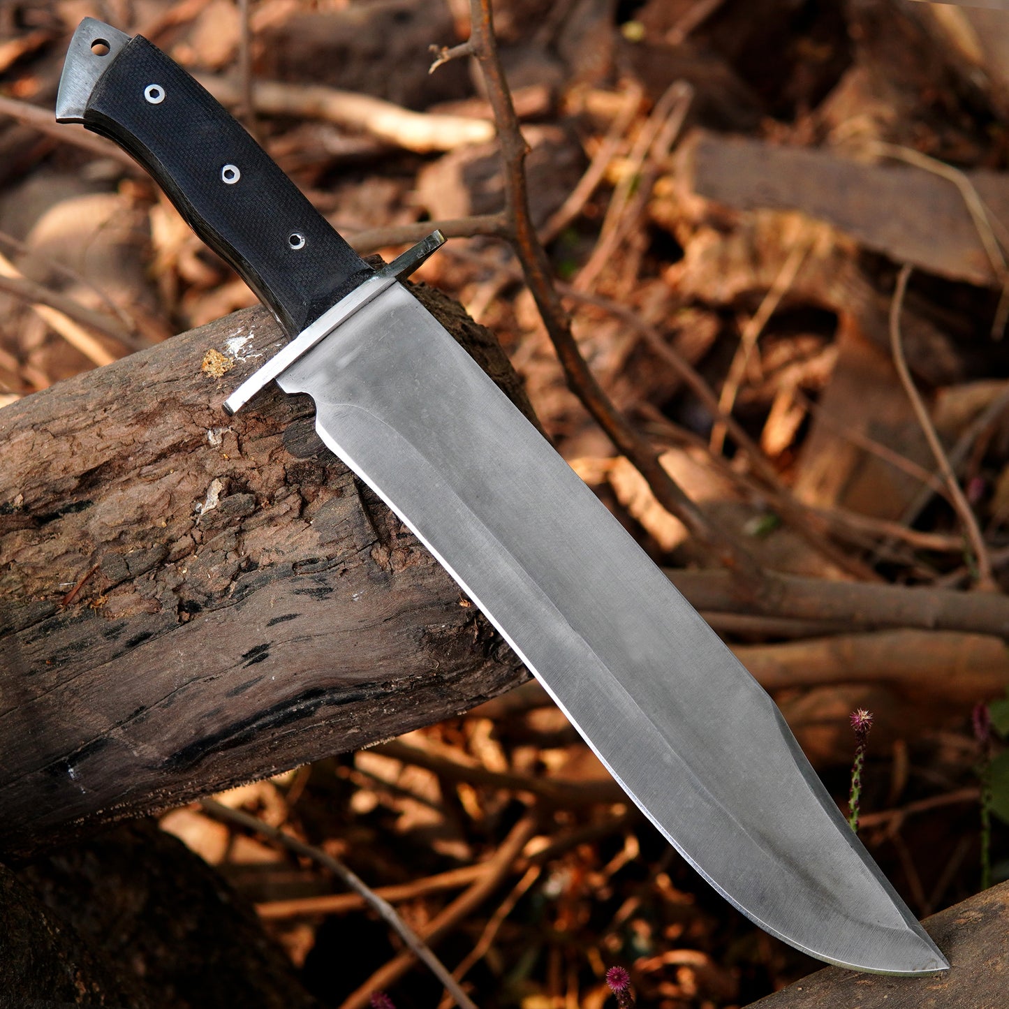 Custom crafted bowie knife featuring a clean steel blade and textured synthetic handle for secure grip.