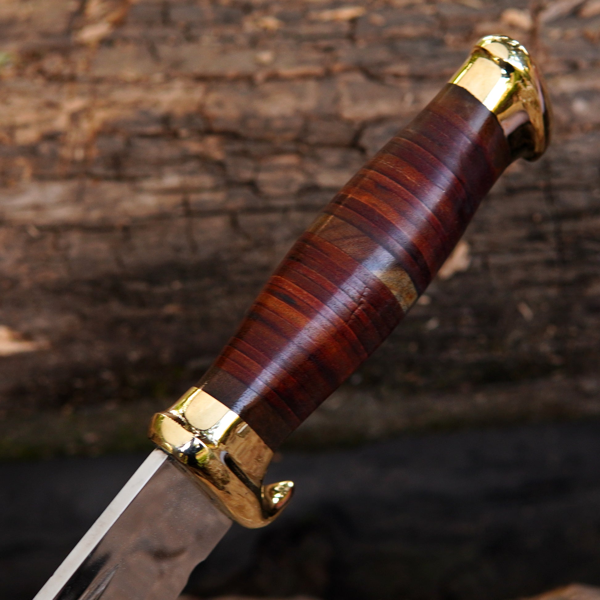 Close-up of the leather sheath crafted from pure leather with detailed stitching and secure snap closure. The sheath is designed to safely hold the knife and provide convenient belt carry. Its rich brown color complements the knife’s handle and brass fittings, creating a complete premium set. This makes it an excellent anniversary gift, birthday gift, or personalized present for him.