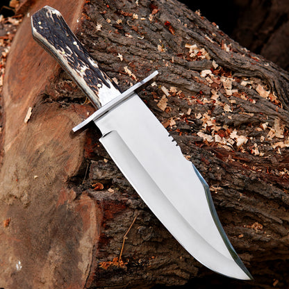 Custom crafted bowie knife showing clean blade finish and textured natural material handle.Custom crafted bowie knife showing clean blade finish and textured natural material handle.