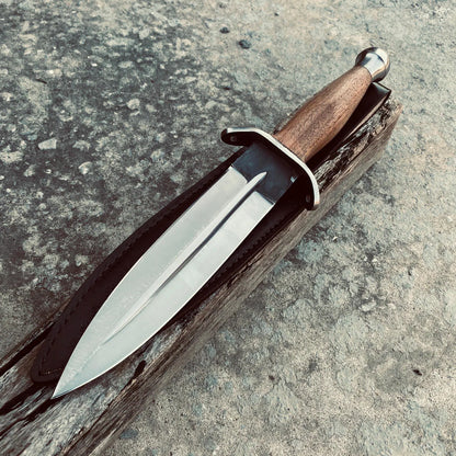Handmade double-edge dagger knife crafted from 1095 carbon steel with a wooden handle.