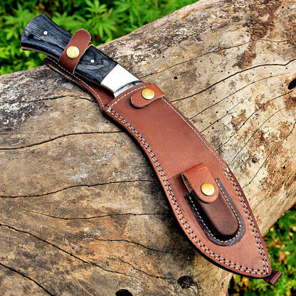 Custom forged Damascus steel Kukri with a black Micarta handle and full tang construction, designed for heavy-duty outdoor and camping use.