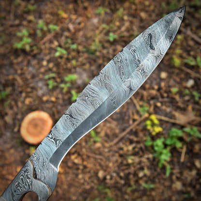 Damascus steel Kukri Bowie knife in action, hand-forged and full tang, built for strength and heavy outdoor work. Features a sharp cutting edge and camel bone handle, making it a perfect choice for hunting, chopping, and survival enthusiasts.