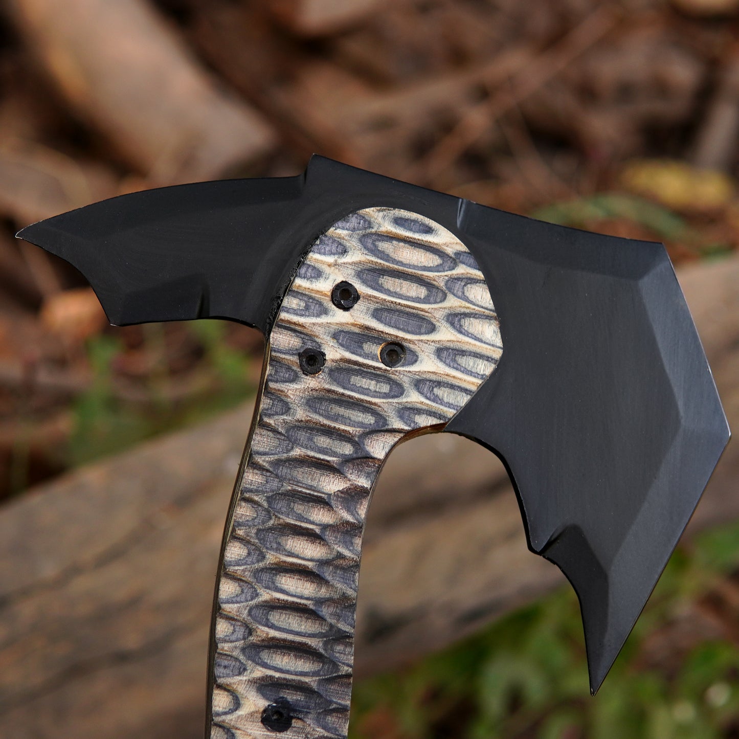 Close-up of a precision-finished steel axe head with clean lines and solid build.