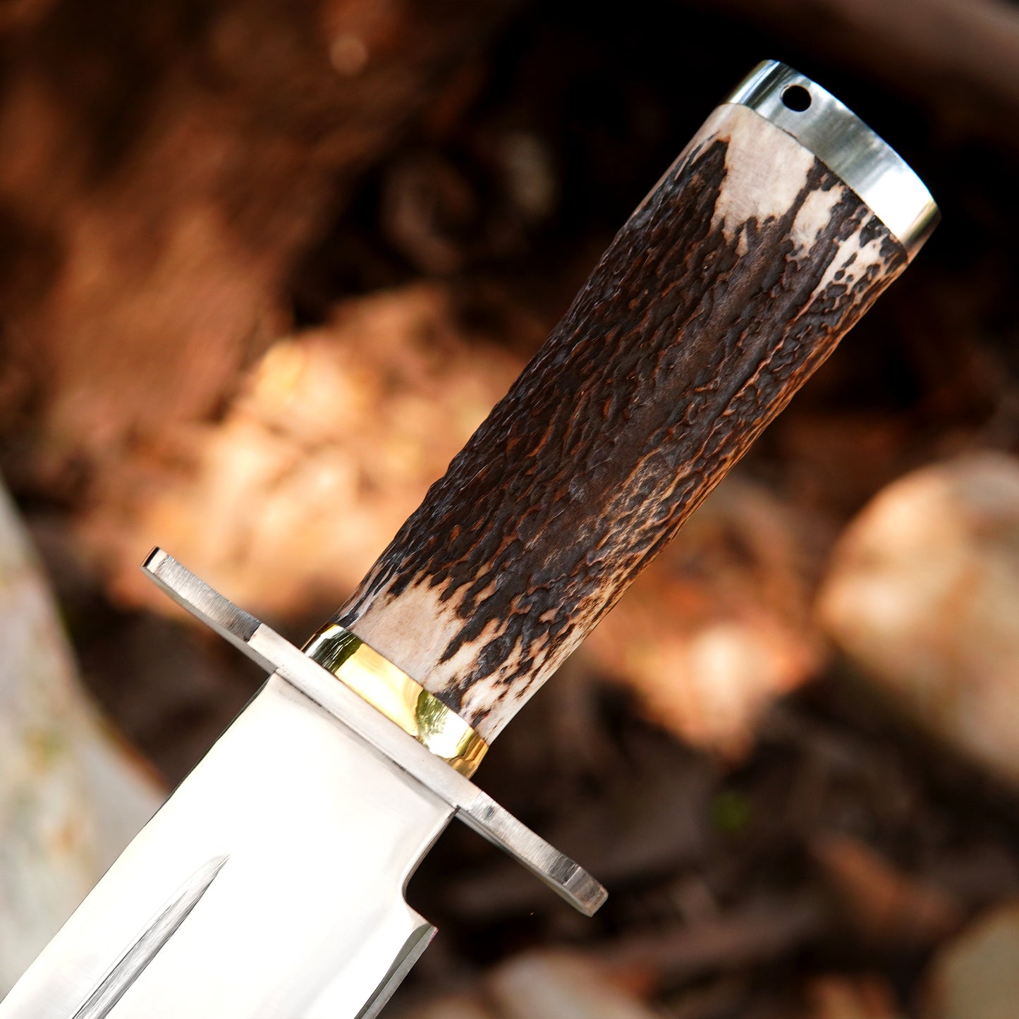 Premium black leather sheath paired with a handmade bowie style knife for safe carry.