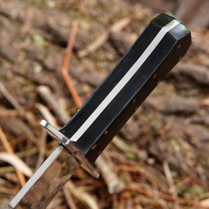 Close-up of a polished steel blade bowie knife with clean lines and refined finish.