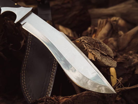 Side view of the polished carbon steel blade showing the recurve profile and edge.