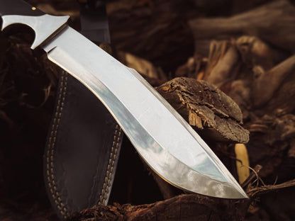 Side view of the polished carbon steel blade showing the recurve profile and edge.