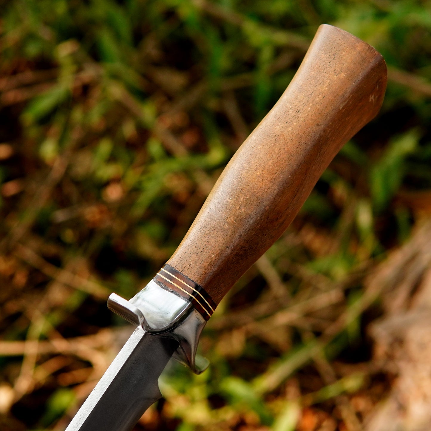 Complete knife and pure leather sheath set placed in natural forest environment demonstrating practical carry solution for hikers hunters and campers who need safe storage and quick access to their fixed blade tool