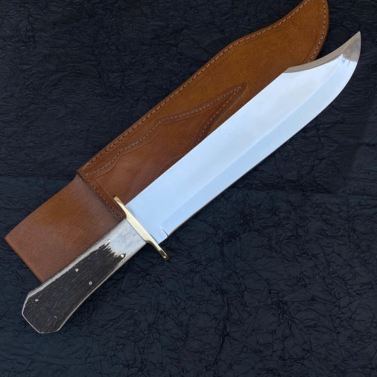Handmade Bowie knife with stag handle and full tang carbon steel blade.