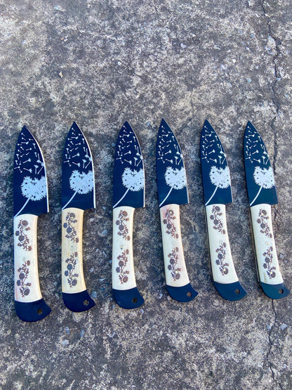 Six handmade carbon steel steak knives in black leather roll kit with elegant engraving.