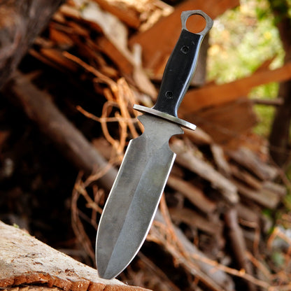 Close up of black micarta handle showing textured grip and ergonomic design.