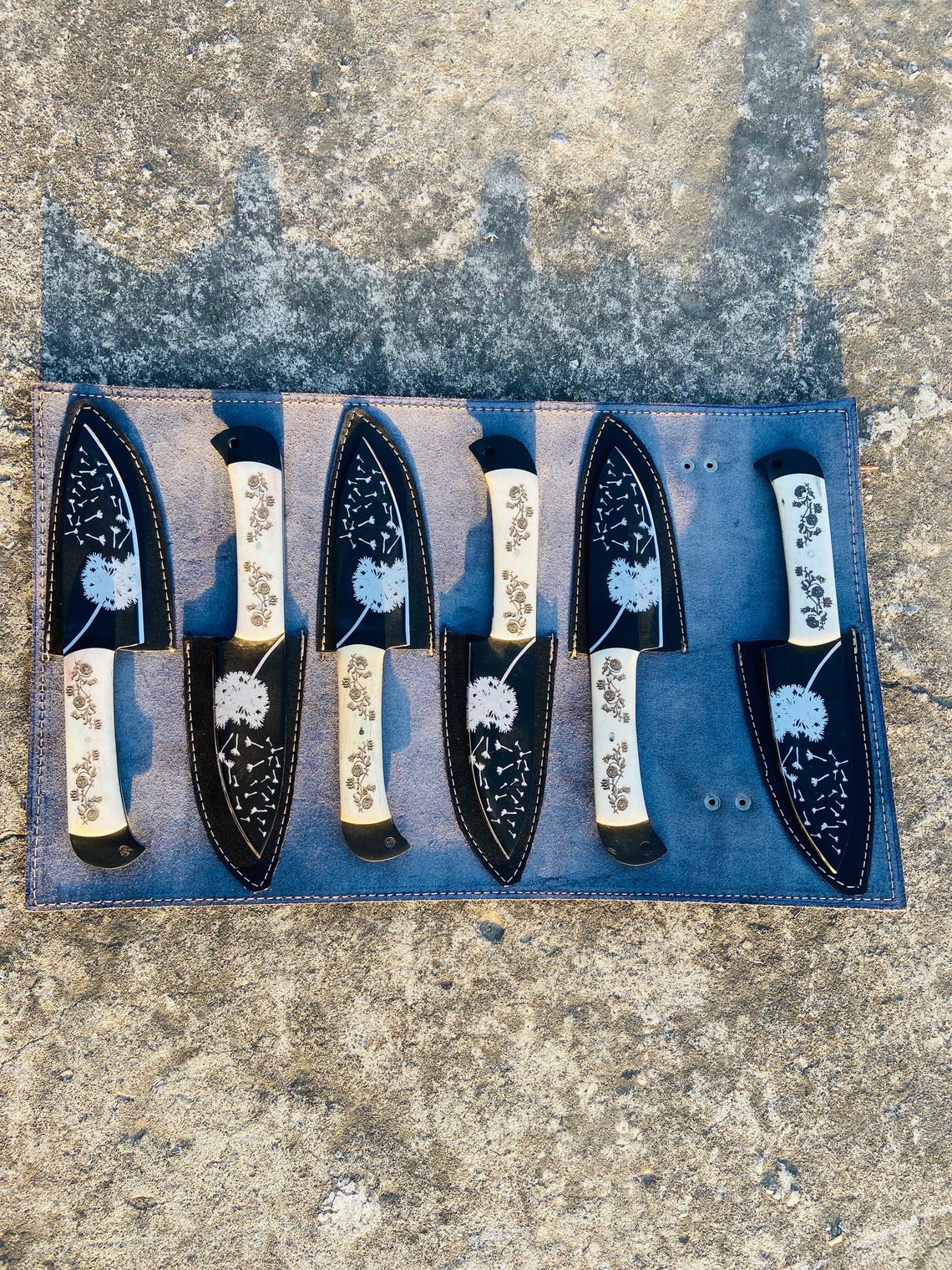 Complete 6-piece handmade steak knife set with handstitched leather roll for kitchen and camping use.