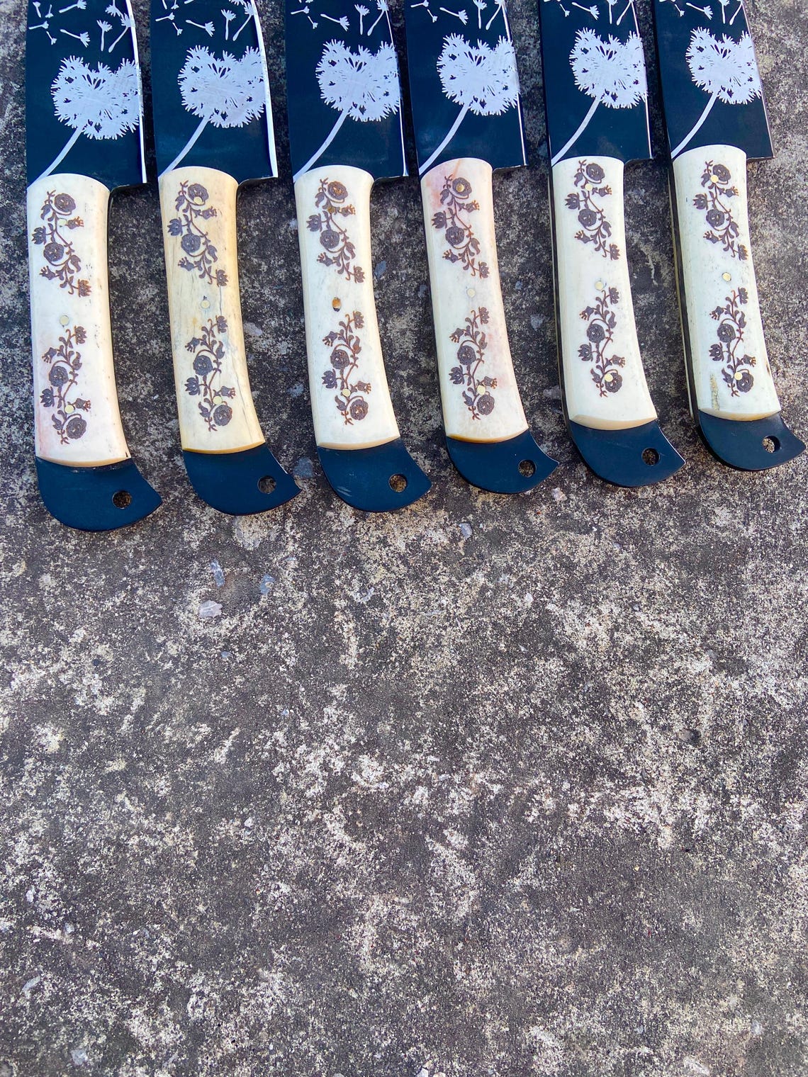 Floral engraved kitchen steak knife gift set with carbon steel blades and leather roll packaging.