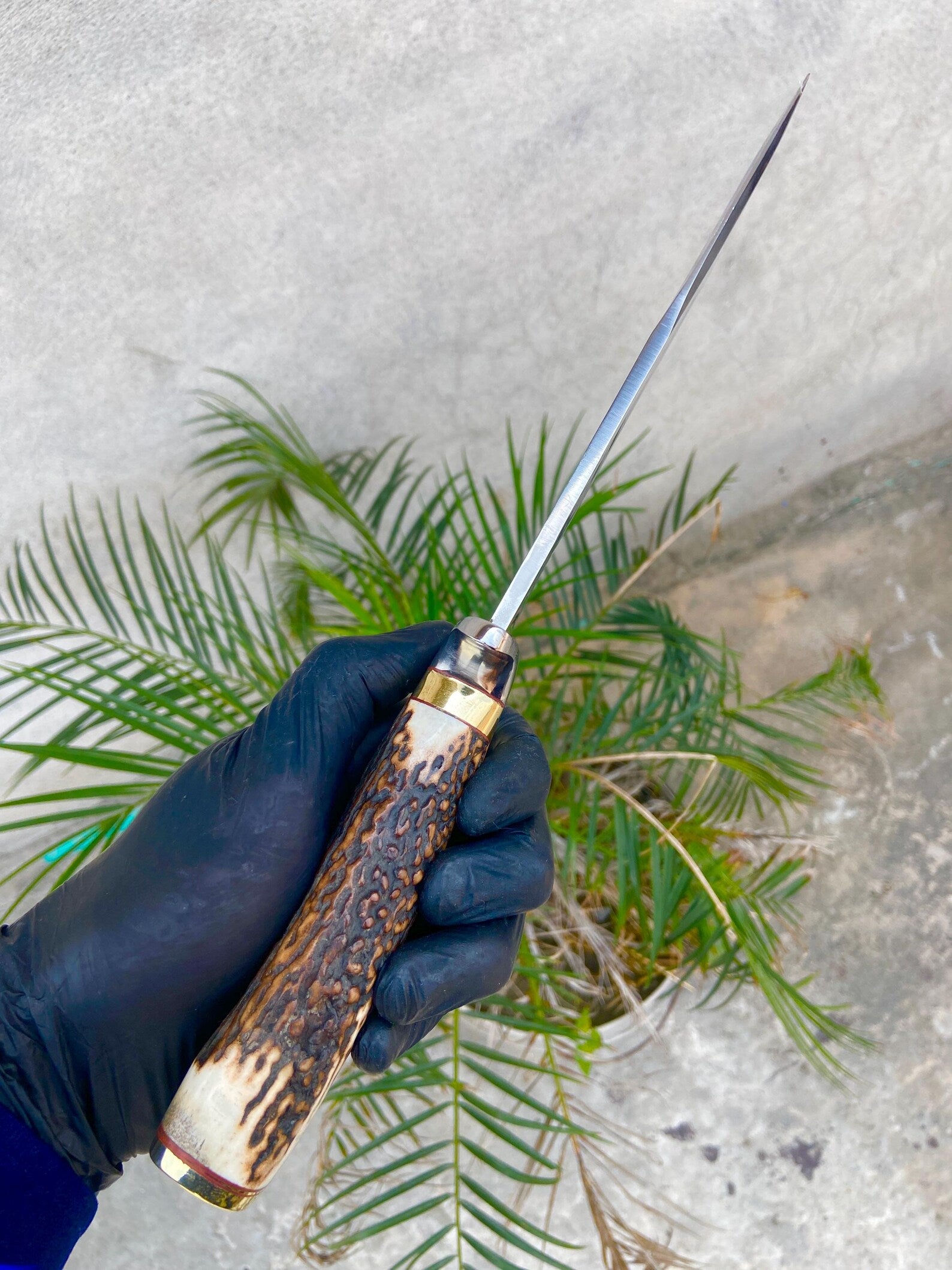 Full view of handmade Bowie knife with mirror-polished carbon steel blade and natural textured handle for outdoor use.