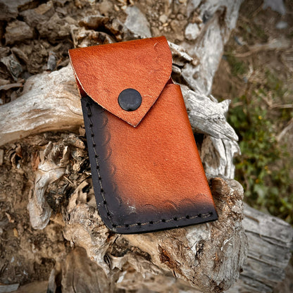 Fish Damascus pocket knife open blade view showing detailed steel pattern and comfortable folding mechanism.