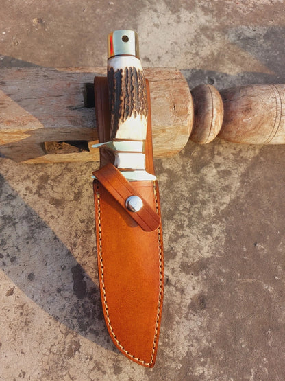 Custom hunting knife handmade with carbon steel, mirror-finished blade, natural handle, and brass guard. Includes a durable stitched leather sheath, making it a perfect choice for camping, survival, hunting, or display in a collection.