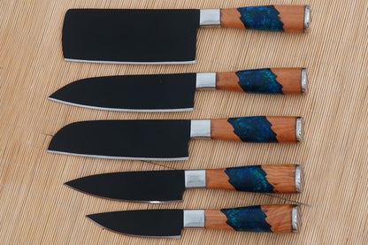 An original handmade chef knife set forged from black carbon steel with resin handles. This 5 piece set is sharp, stylish, and practical for kitchens or BBQ use. It comes with a sheath and free engraving to create a unique gift set.