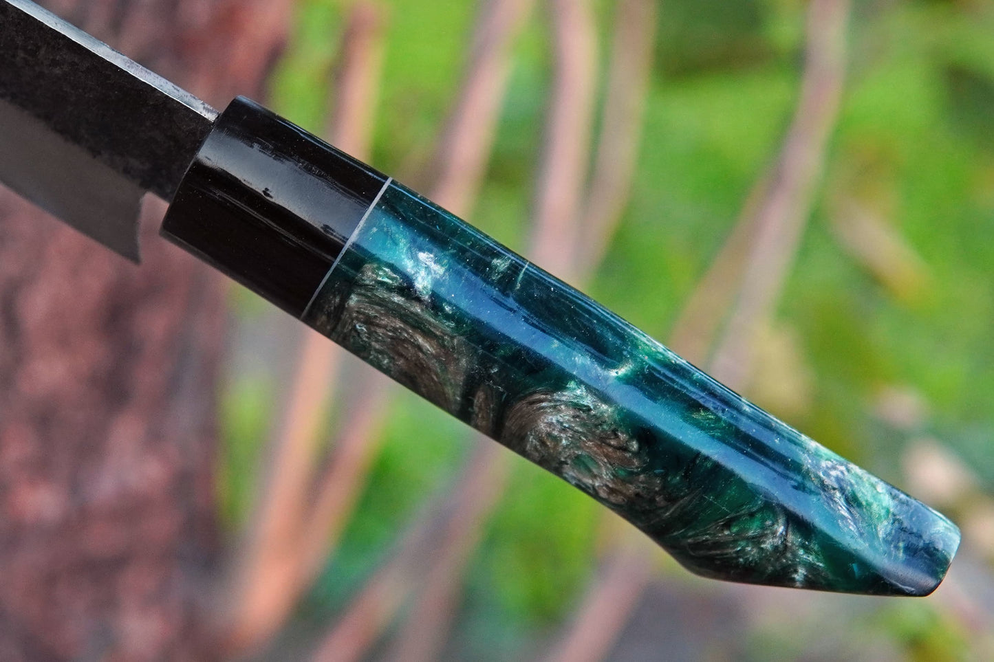 This outdoor cooking knife is forged from 5160 spring steel with a handmade resin handle. Designed for chopping and slicing while camping, BBQ, or in the kitchen, it combines durability with style. Personalisation available at no extra cost.