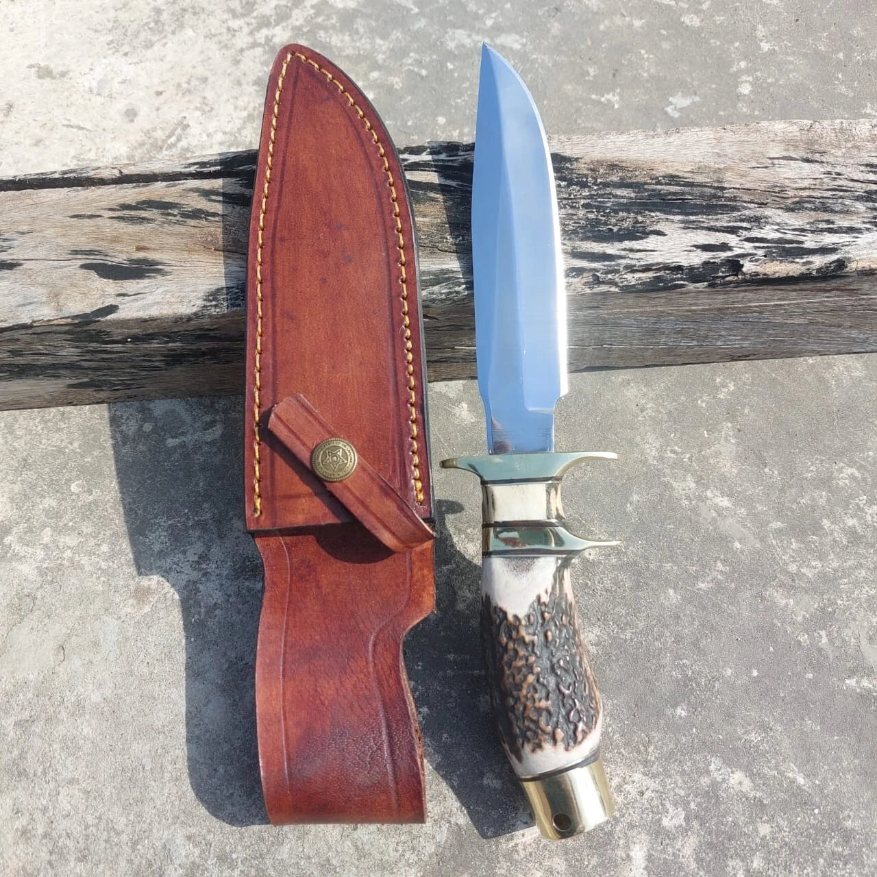 Handmade subhilt hunting knife with high carbon steel blade, brass guard, and leather sheath. A reliable outdoor tool designed for hunters, adventurers, and collectors seeking strength, durability, and craftsmanship in one knife.