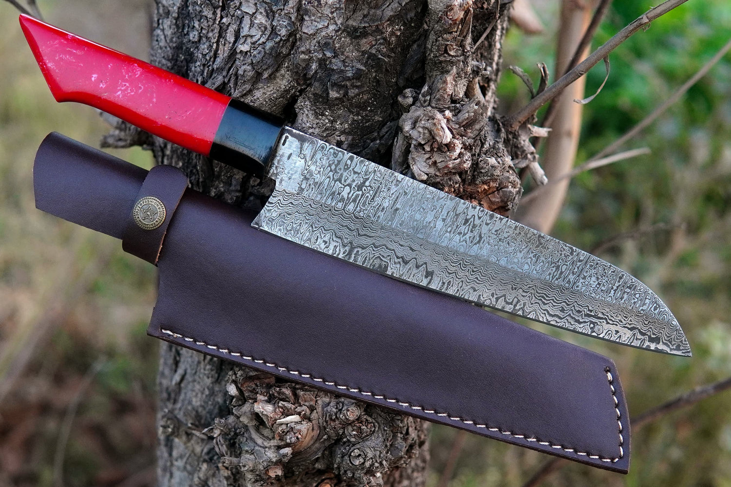 A handmade chef knife forged from Damascus steel with a polished pink resin handle. Featuring visible true Damascus layers, this full tang knife is sharp, durable, and perfect for cooking, camping, or BBQ. Free engraving included to make it personal.