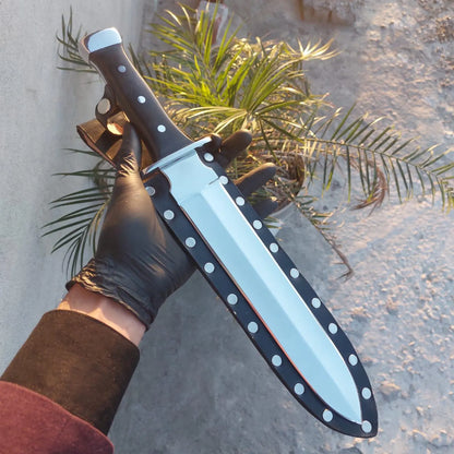 Handle closeup showing black wood and polished pommel.