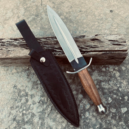 Custom handmade dagger displayed with its leather sheath.