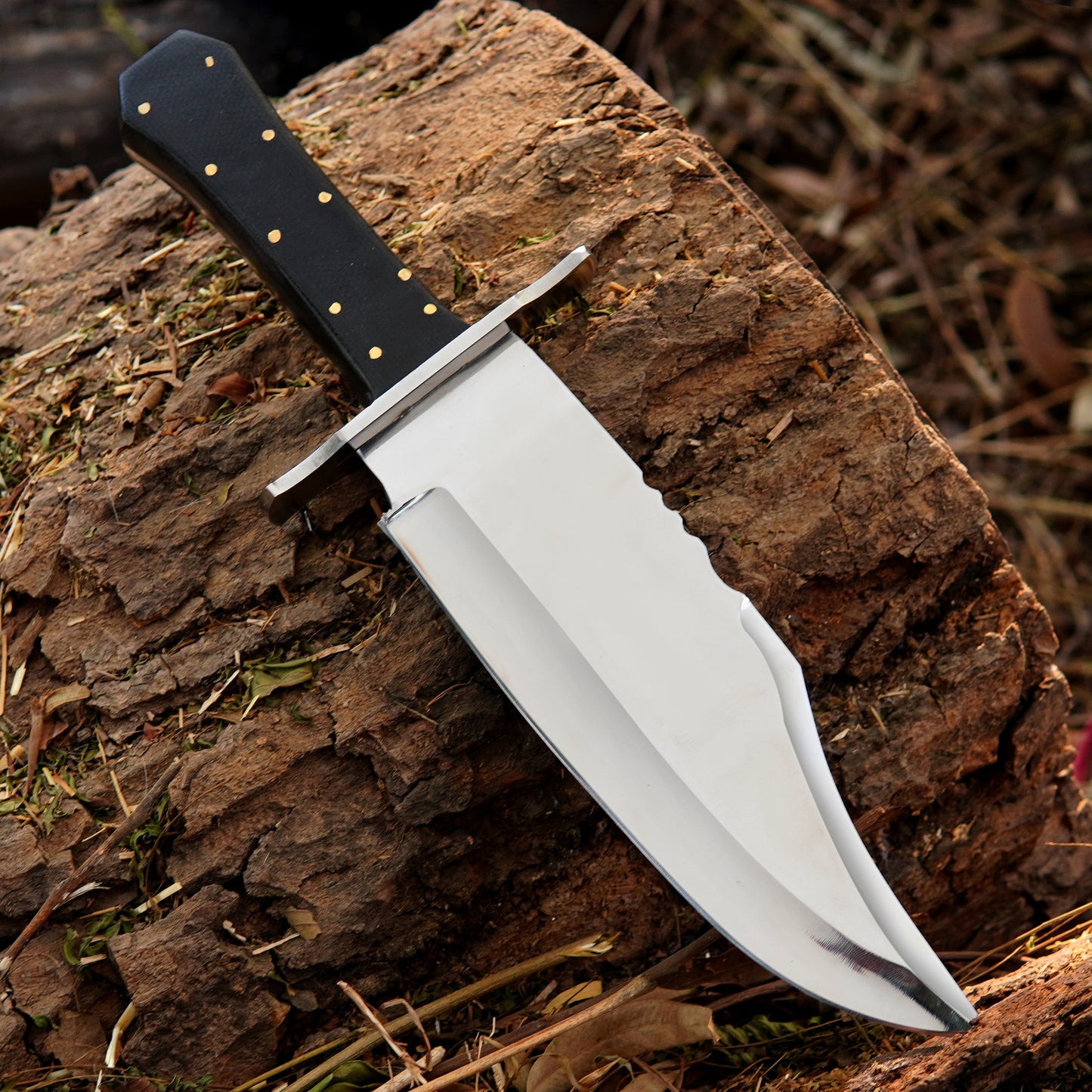 Custom crafted bowie knife featuring a smooth steel blade and textured synthetic handle for secure grip.