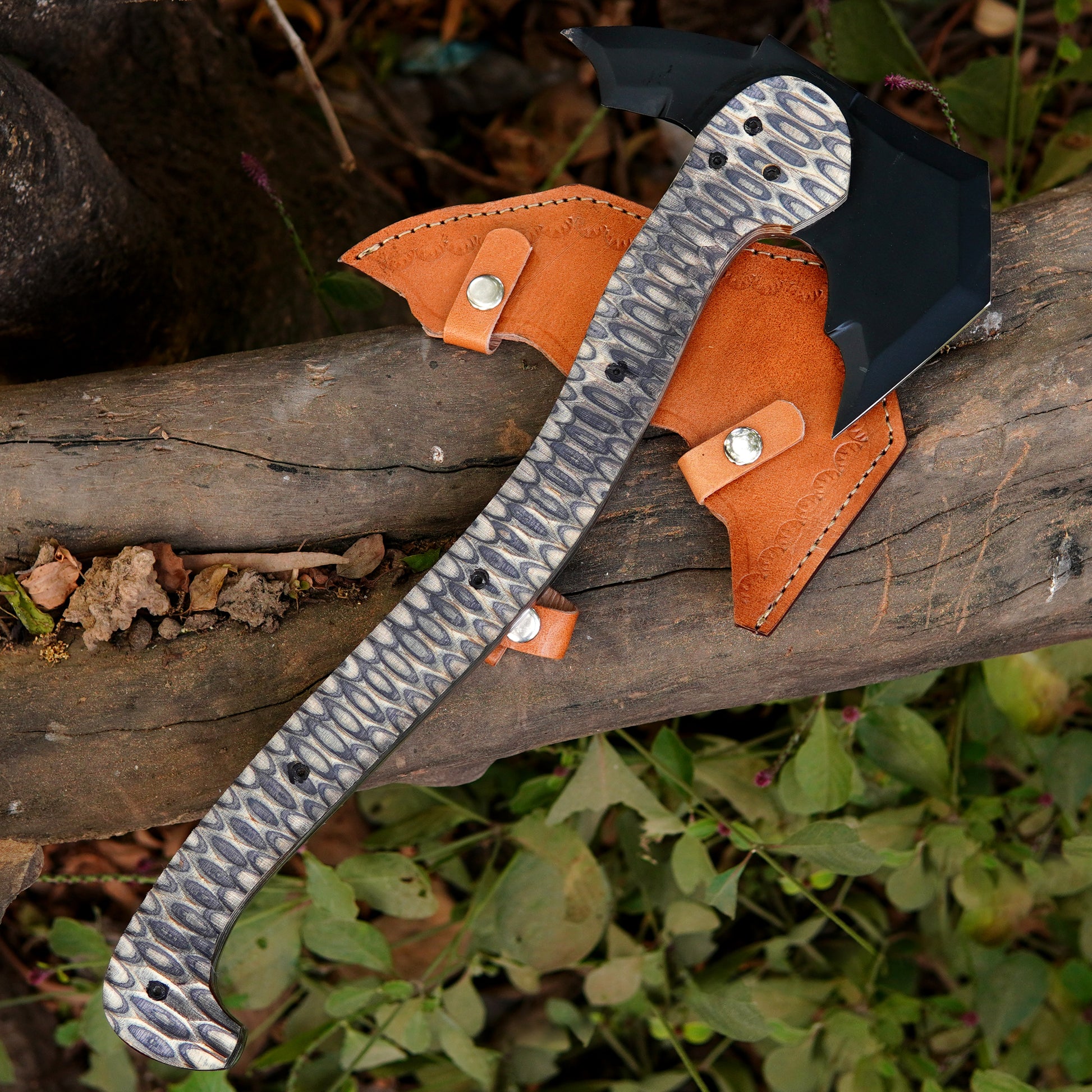 Handmade full tang camping axe with steel head, durable composite handle, and leather sheath displayed on wood.