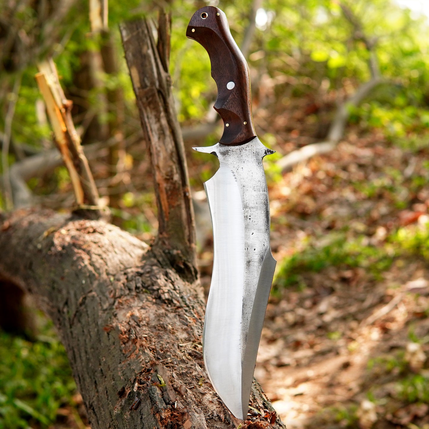 Custom crafted bowie knife featuring a satin finished steel blade and ergonomic wooden handle.