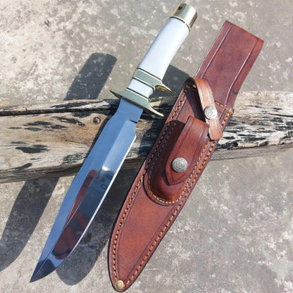 Collector hunting knife featuring a white handle, polished steel blade, and brass guard. Comes with a handmade leather sheath for safe carrying and long-term durability.