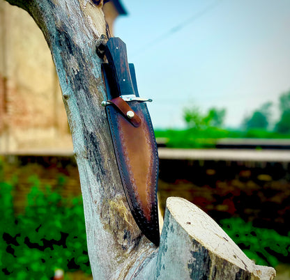 Full tang handmade Bowie knife with a razor-sharp 1095 carbon steel blade, ergonomic wenge wood handle, and hand-sewn premium leather sheath for durability.