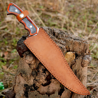 Detailed view of the carbon steel blade with polished finish and sawback spine for added cutting performance. The thick blade provides strength and durability for wood cutting rope slicing and field work.