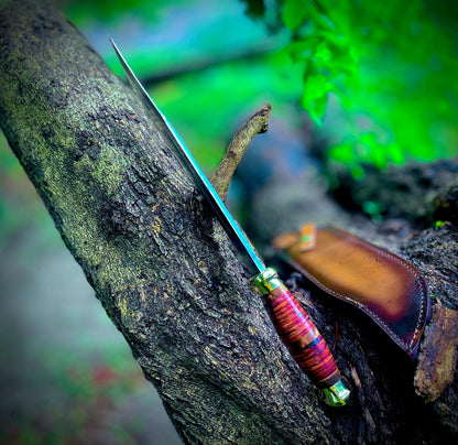 Large Crocodile Dundee style Bowie knife with razor-sharp carbon steel blade and stacked leather handle, paired with a premium handmade sheath. This iconic design combines strength, balance, and beauty, making it perfect for hunting, camping, or as a collector’s showpiece. Each knife is individually handmade to ensure durability and uniqueness.