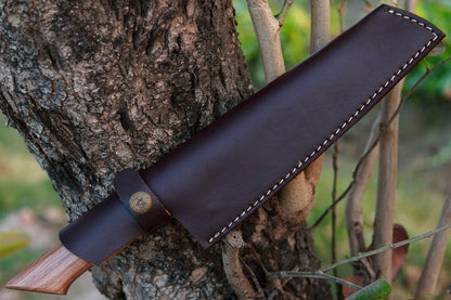 This unique chef knife is hand forged from 5160 spring steel with a smooth olive wood handle. Strong, sharp, and versatile, it’s ideal for kitchen chefs, BBQ lovers, or campers. Personalisation is included at no extra cost.