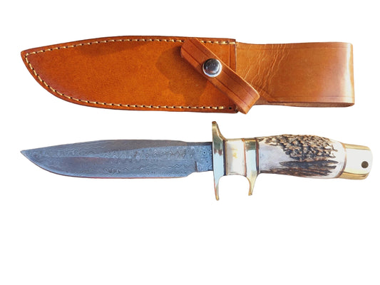 Custom damascus hunting knife with natural grip handle and polished brass fittings. The detailed hand forging on the blade shows unique damascus layers that highlight craftsmanship. Comes with a leather sheath to keep the knife safe and easy to carry during outdoor activities. Designed for hunters, collectors, and outdoor enthusiasts.