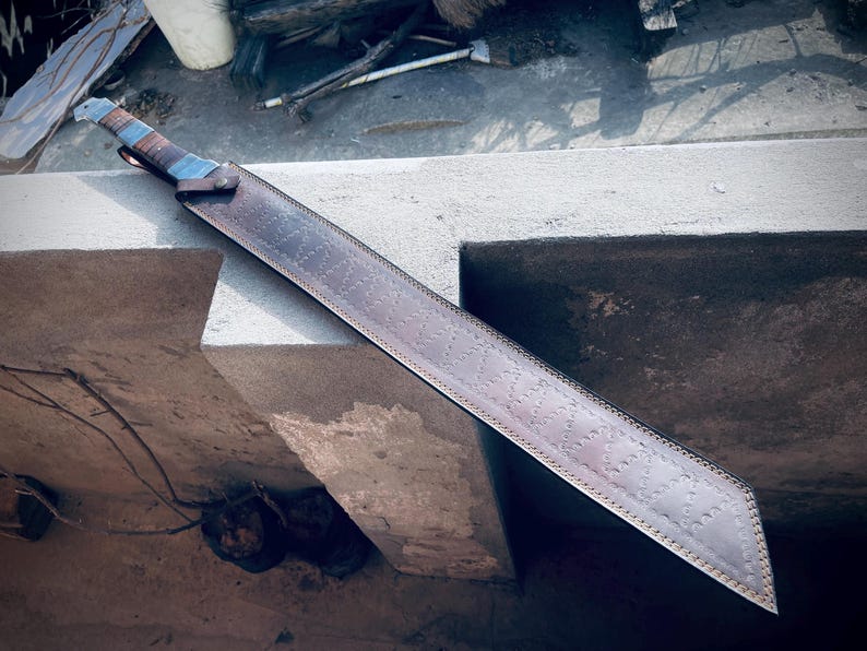 Damascus pattern visible on handmade Viking machete-style sword blade.