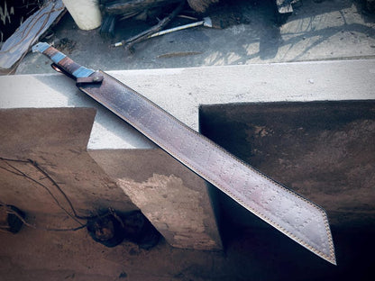 Damascus pattern visible on handmade Viking machete-style sword blade.