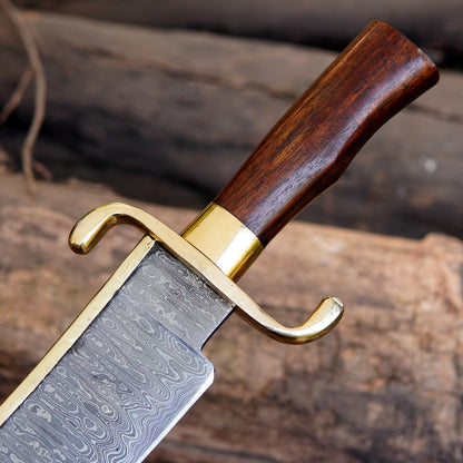 Wooden handle closeup of handmade bowie knife showing smooth polish, ergonomic shape, and brass guard connection. The image focuses on grip comfort and traditional styling, suitable for buyers looking for strong and visually appealing handmade outdoor knives.
