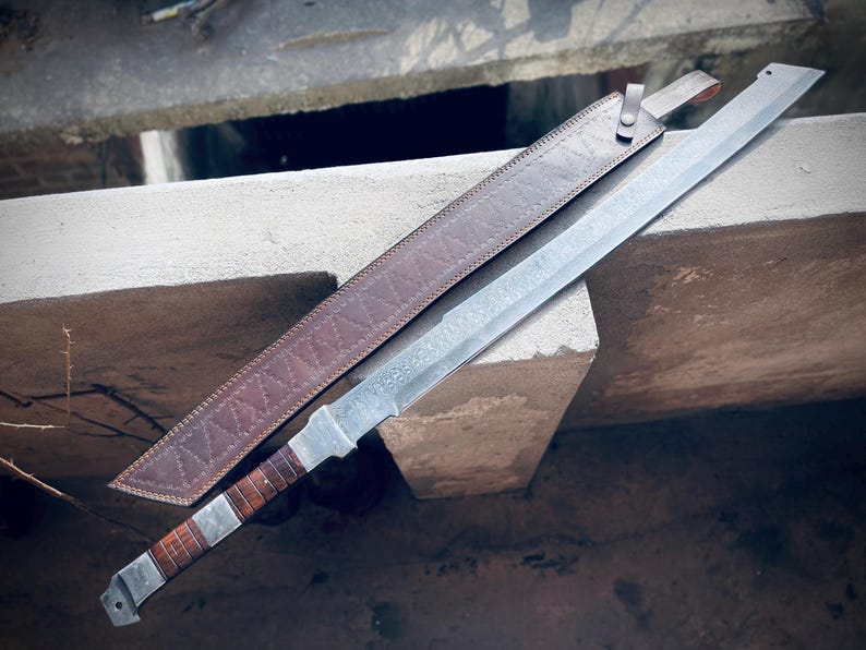 Large handmade Damascus steel sword with brown handle and sheath.